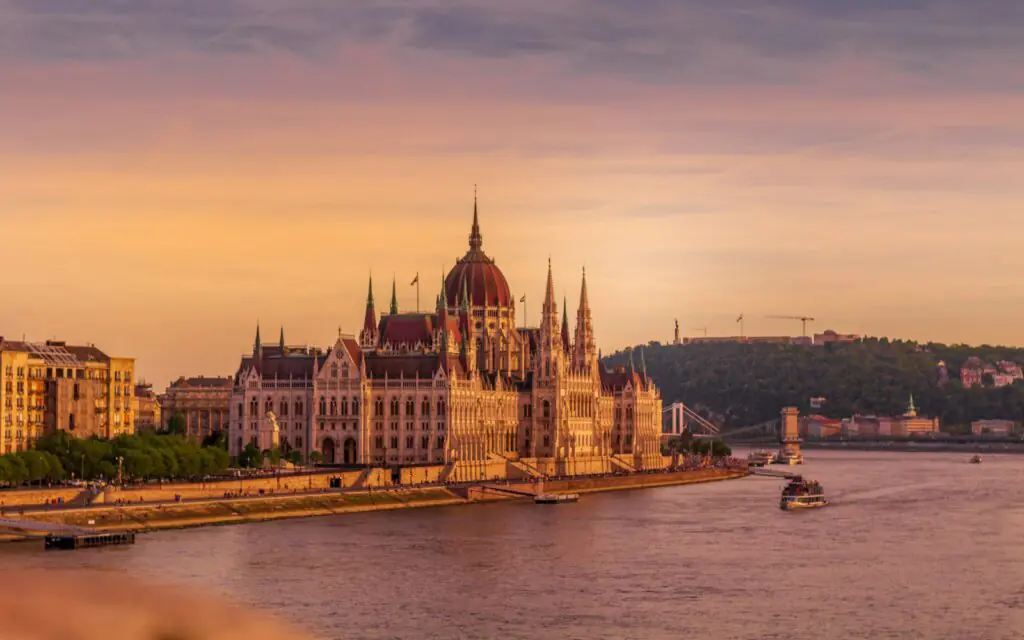 The Hungarian Parliament on the Danube at sunset with the Chain Bridge beyond